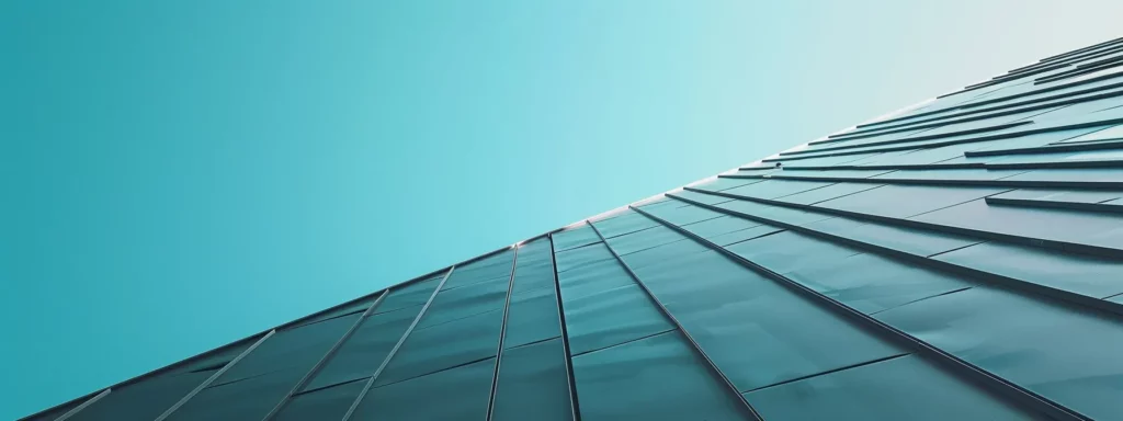 a close-up view of a skilled roofer meticulously applying high-quality roofing materials on a contemporary urban building, set against a clear blue sky, emphasizing professionalism and durability.